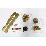 A collection of military items to include buttons, badges and a War Department brass button stick,