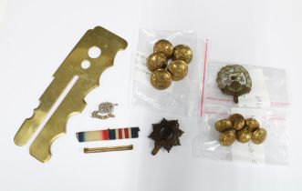 A collection of military items to include buttons, badges and a War Department brass button stick,