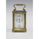 Miniature brass and glass cased alarm carriage clock, with key 9.5cm including handle