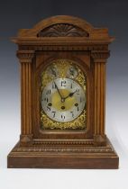 Junghans Wurttemberg clock, oak case with brass movement numbered B20 and 140 at base of plate, 44cm