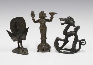 Three Indian bronze figures to include a deity and a peacock, etc , tallest 12cm (3)