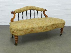 Victorian low settee, upholstered scroll back and seat with spiral splats, 138 x 70 x 59cm.