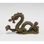 A bronze dragon and pearl of wisdom figure, 12cm long
