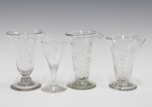 Four vintage glass measuring cylinders, tallest 11cm (4)