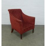 An upholstered armchair, on mahogany legs with brass caps and castors, 71 x 89 x 49cm.