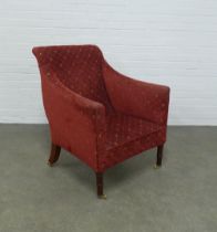 An upholstered armchair, on mahogany legs with brass caps and castors, 71 x 89 x 49cm.