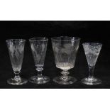 Four 18th century wine glasses, etched patterns include fruit and vine, wheatsheaf and ribbon