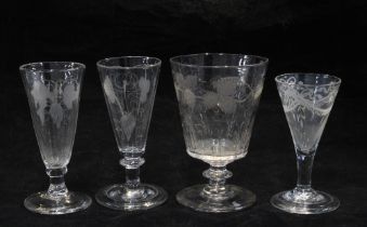 Four 18th century wine glasses, etched patterns include fruit and vine, wheatsheaf and ribbon