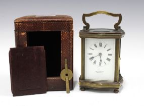 Brass and glass cased carriage clock, the enamelled dial inscribed De la Cour Chatham, with