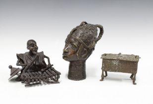 Benin bronze head, 18cm high, a small bronze table casket and a bronze figure of a musician