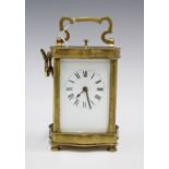 Brass and glass panelled repeating carriage clock, with key, 15cm including handle
