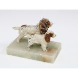 Early 20th century group of two cold painted spelter spaniel figures on a hardstone base, 9cm