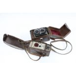 Two vintage cameras in cases, to include MPP Micro Precision and a Bell & Howell model 624, larger
