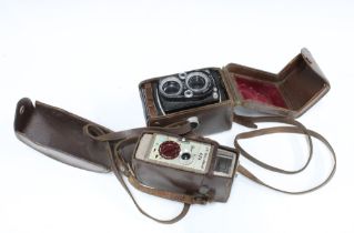 Two vintage cameras in cases, to include MPP Micro Precision and a Bell & Howell model 624, larger