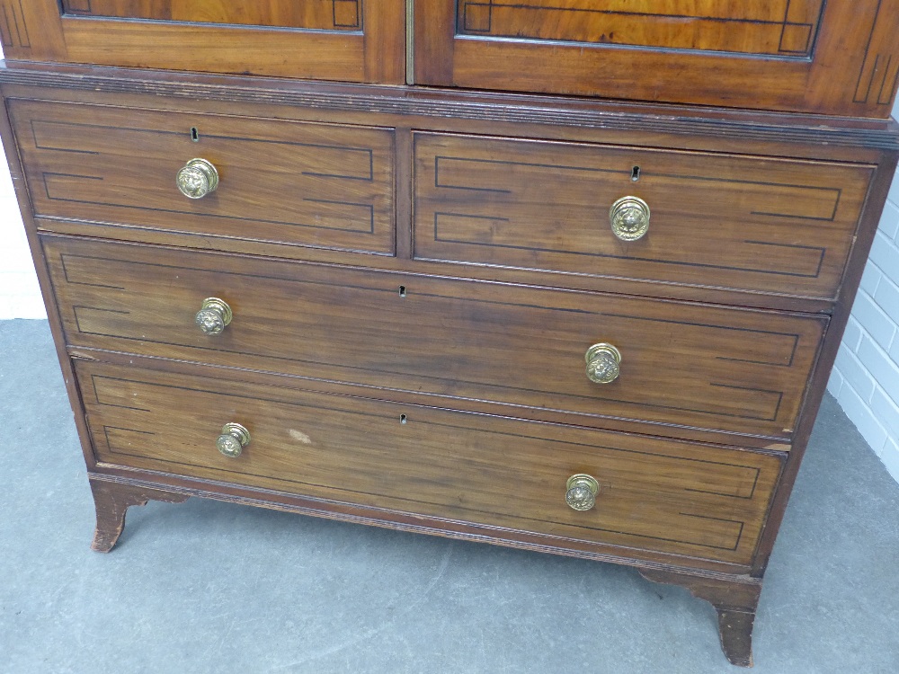 Georgian mahogany linen press, stepped pediment above a pair of flame veneered doors, internal brass - Image 2 of 5