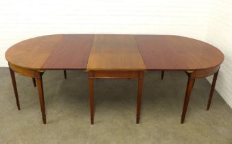 19th century mahogany D-end dining table, with two extra leaves and brass clips, raised on square