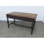 Late 19th century ebonised carved centre table, 127 x 74 x 67cm.