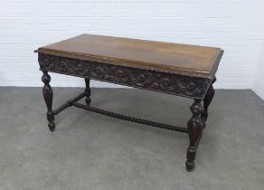 Late 19th century ebonised carved centre table, 127 x 74 x 67cm.
