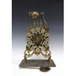 Brass skeleton clock, triple fusee (three train) striking on eight bells, 44cm