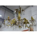 Gilt metal eight branch chandelier, decorated in grape leaves, with glass drops, approximately 50