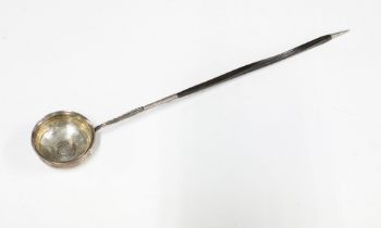 Georgian unmarked white metal toddy ladle, the bowl inset with a coin, baleen handle, 39cm long
