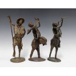 Three Nigerian bronze figures, tallest 36cm (3)