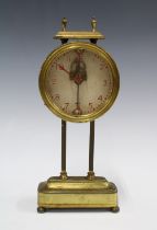 Brass cased Mystery Gravity mantle clock, with red painted arabic numerals, case numbered PAT 15238,