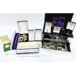 A mirrored glass jewellery box containing a collection of silver and costume jewellery together with