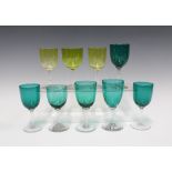 Collection of coloured wine glasses, to include six green and three yellow, tallest 13cm (9)