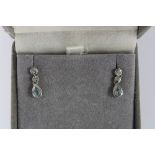 A pair of 18ct white gold diamond and aquamarine drop earrings, stamped 750