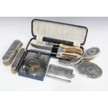 A white metal backed four piece dressing table set, horn handled carving set. pewter hip flask and a
