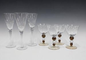 Set of four glasses with brown bobble stems, 16cm, together with three flute glasses (7)
