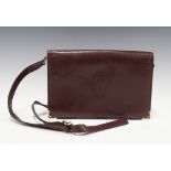 Maroon leather handbag with a Cartier logo, 28 x 19cm