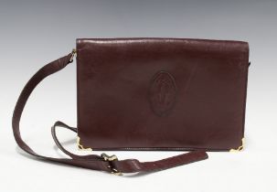 Maroon leather handbag with a Cartier logo, 28 x 19cm