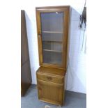 An Ercol Golden Dawn cabinet, 47 x 162 x 44cm.