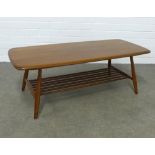 An Ercol Golden Dawn elm coffee table, 103 x 37 x 46cm.