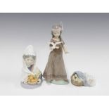 Three Lladro figures, including American Love 6153, Valencian Harvest 5668 and another,