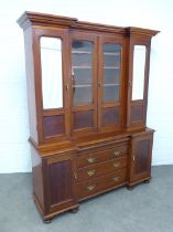 Mahogany bookcase cabinet, inverted breakfront top with glazed doors and shelved interior over three