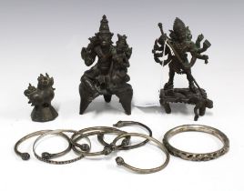 Two bronze deity figures, 13cm high, a small bronze animal and a collection of bangles (a lot)