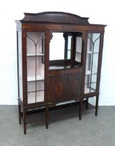 Mahogany display cabinet, arched top over a mirror panelled alcove, flanked by astragal glazed