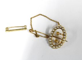 Early 20th century minaute seed pearl buckle brooch set in unmarked yellow metal together with a