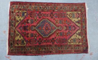 Persian rug, red field with central pole medallion, 150 x 98cm