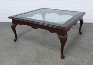 Stained hardwood low table with square glass top on short cabriole legs, 96 x 45cm.