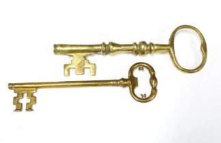 Two oversized brass keys (2)