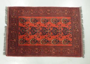 Eastern rug, red field with serrated foliate pattern, 155 x 102cm.