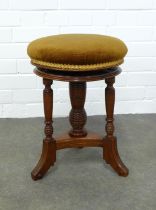 Late 19th / early 20th century mahogany piano stool, circular upholstered seat, 35 x 47cm.