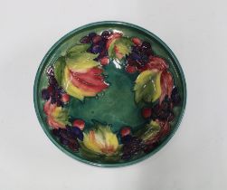 Moorcroft Leaf and Berry bowl, green ground with tube lined pattern, facsimile signature and