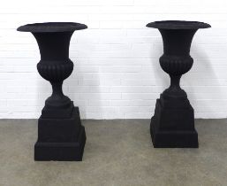 Pair of modern black metal campana style garden urns, 55 x 108cm. (2)