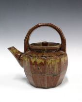 Mike Dodd (British, born 1943) studio pottery teapot, facet sides and stylised loop handle. 20cm