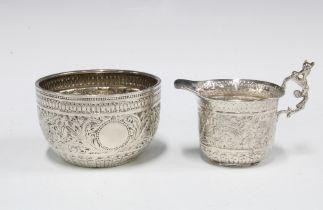 Victorian silver sugar bowl and milk jug with foliate decoration, London 1893, (2)